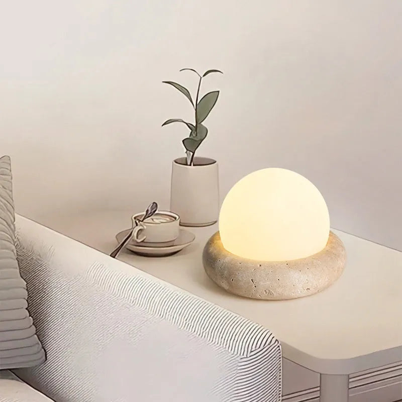 Cream coloured remote control bedside night light with circular 15.5cm diameter design