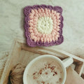 Crocheted wool insulated cup placemat with grandmother lattice pattern in colour choice