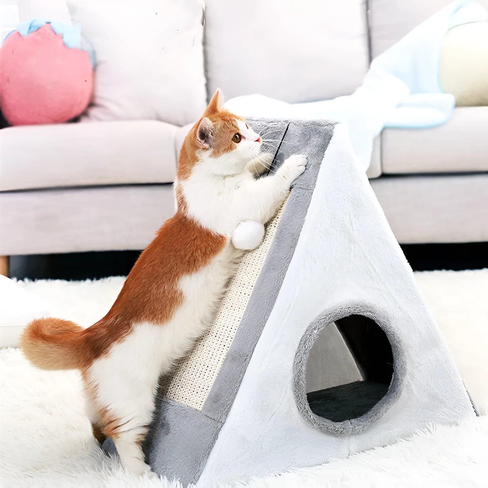 Triangle-shaped grey and white cat nest with integrated sisal scratching post.