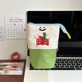 Brown and green Korean-style collapsible Oxford fabric pencil case showing 17cm by 14cm size.