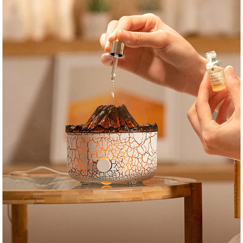 Creative column-shaped volcano humidifier diffuser with LED light flame effect and mist ring.