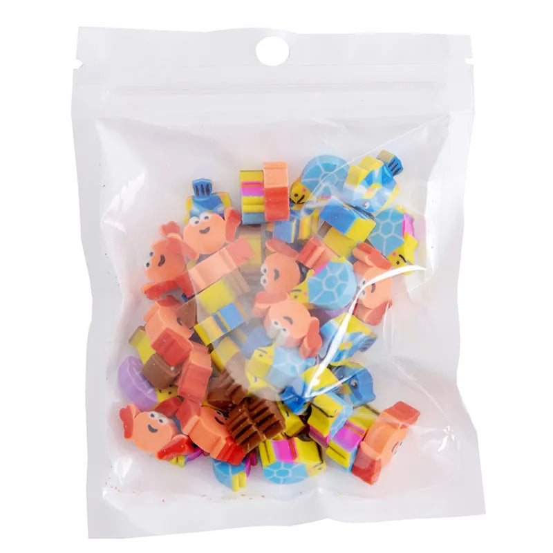 Assortment of 50 colourful mini cartoon erasers in shapes of fruits, animals, and cakes on a white background.