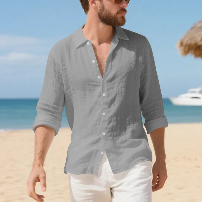 Man wearing a loose-fit light blue linen casual shirt with short sleeves