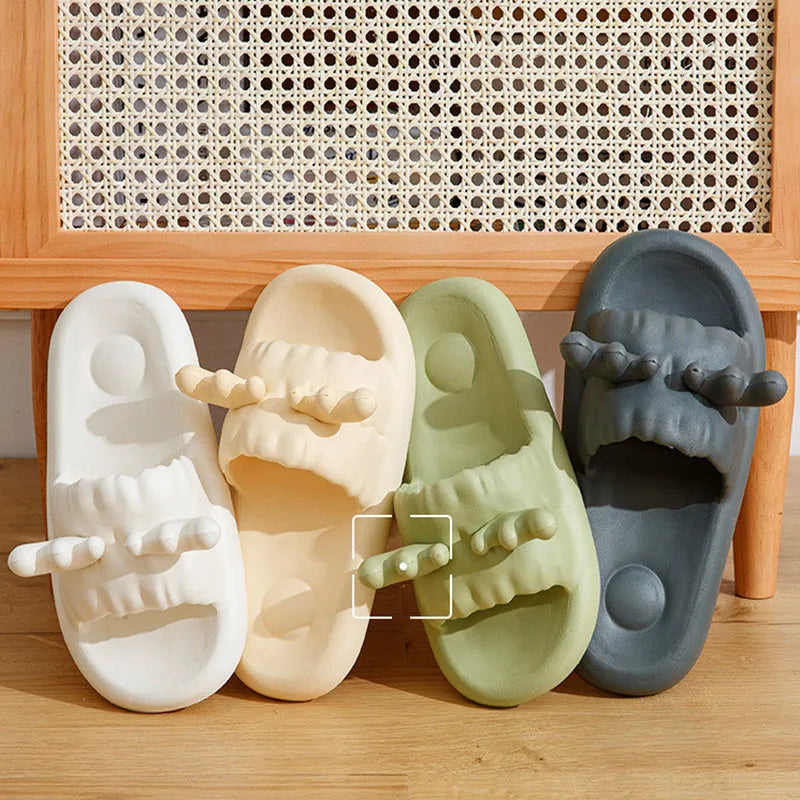 Deer horn design EVA flip flop slippers in light yellow on a white background.