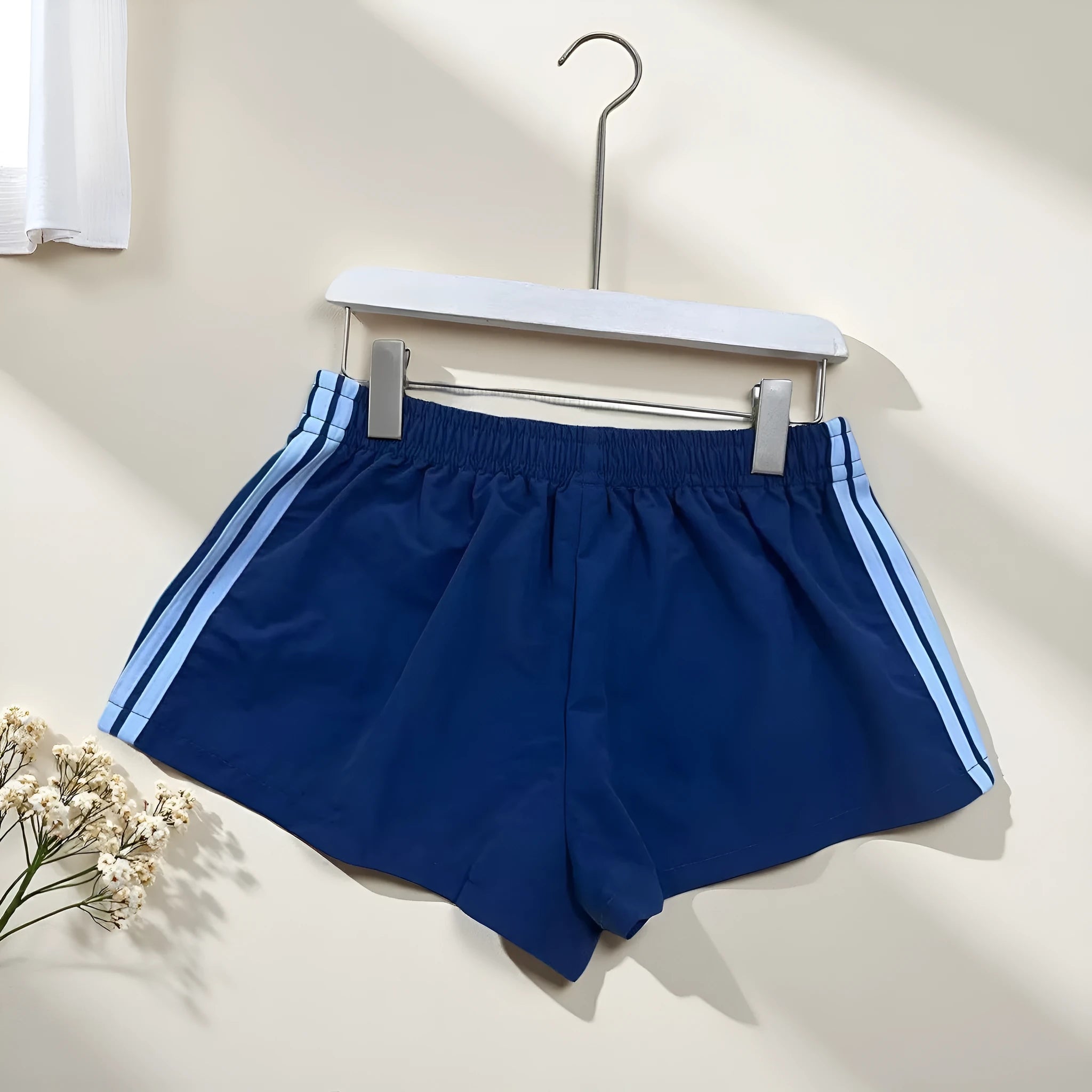 Navy blue men's nylon sport shorts with high-waist elastic waistband
