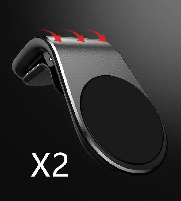 Car phone bracket mounted on vehicle air vent in silver finish showing rotation adjustment