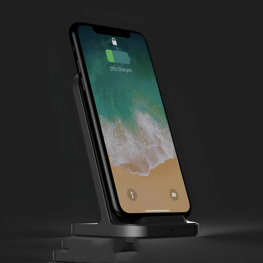 Dark grey vertical wireless charger for Apple iPhone on desktop
