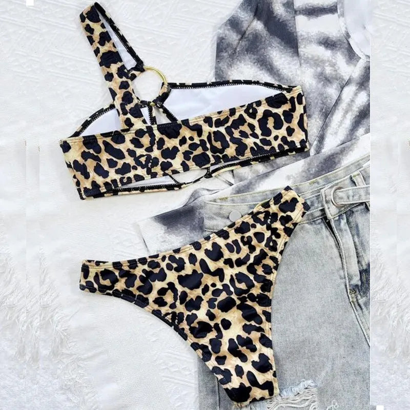 Women's leopard print polka dot bikini top and shorts set on a mannequin