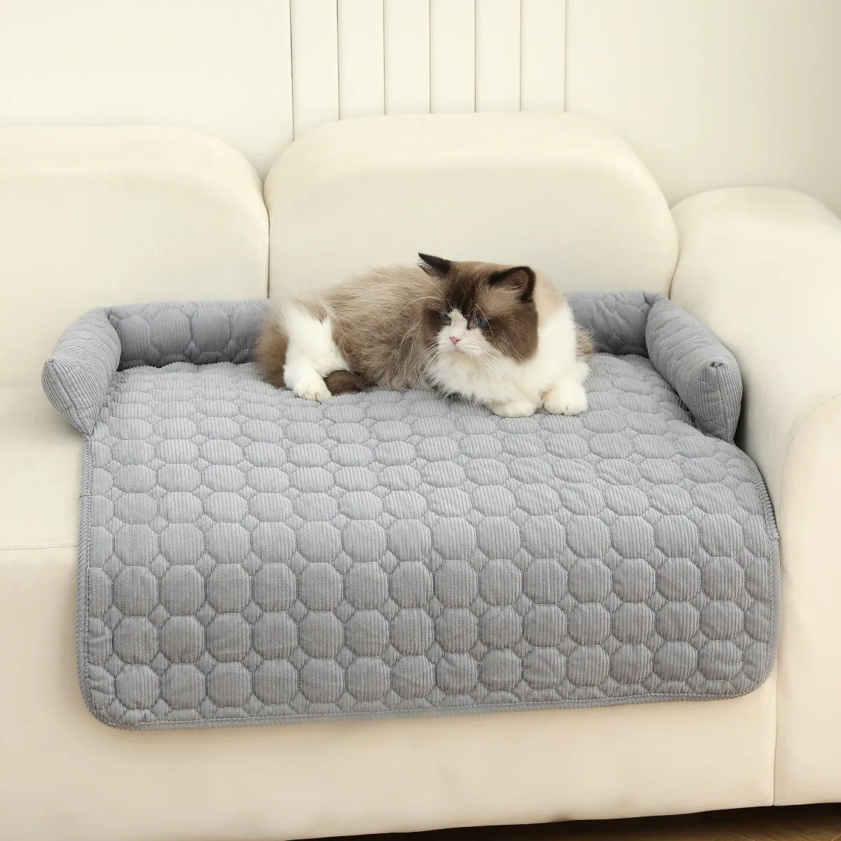 Thick corduroy pet bed mat with neck pillow in beige, 75x75cm, on a floor