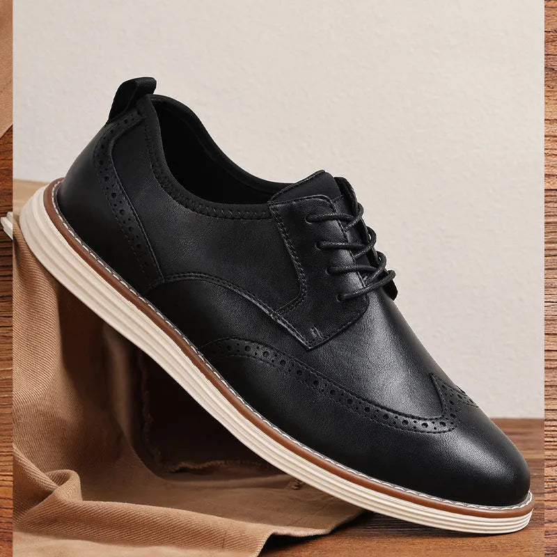 Men's black slip-on casual shoe with PU leather upper and round toe on a grey background.