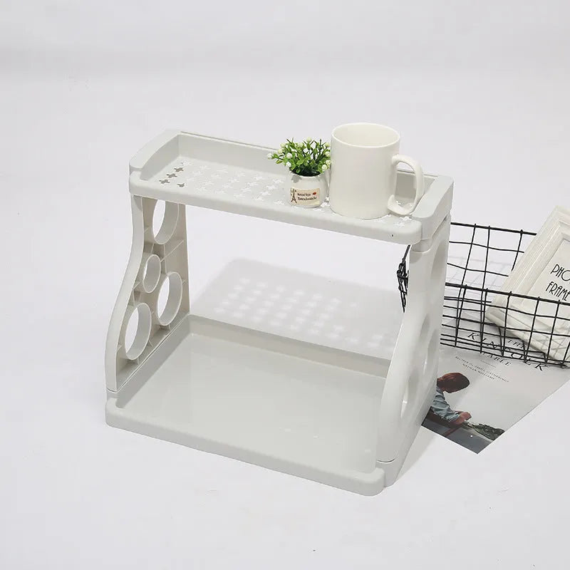 Foldable kitchen storage rack with multilayer shelves in white colour on countertop