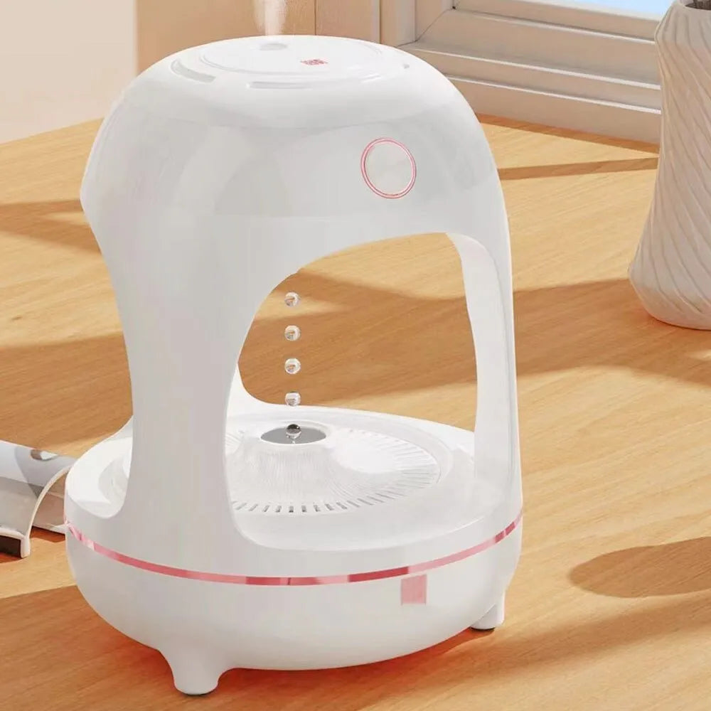 Rose gold and white levitating water drops humidifier with LED light on desk
