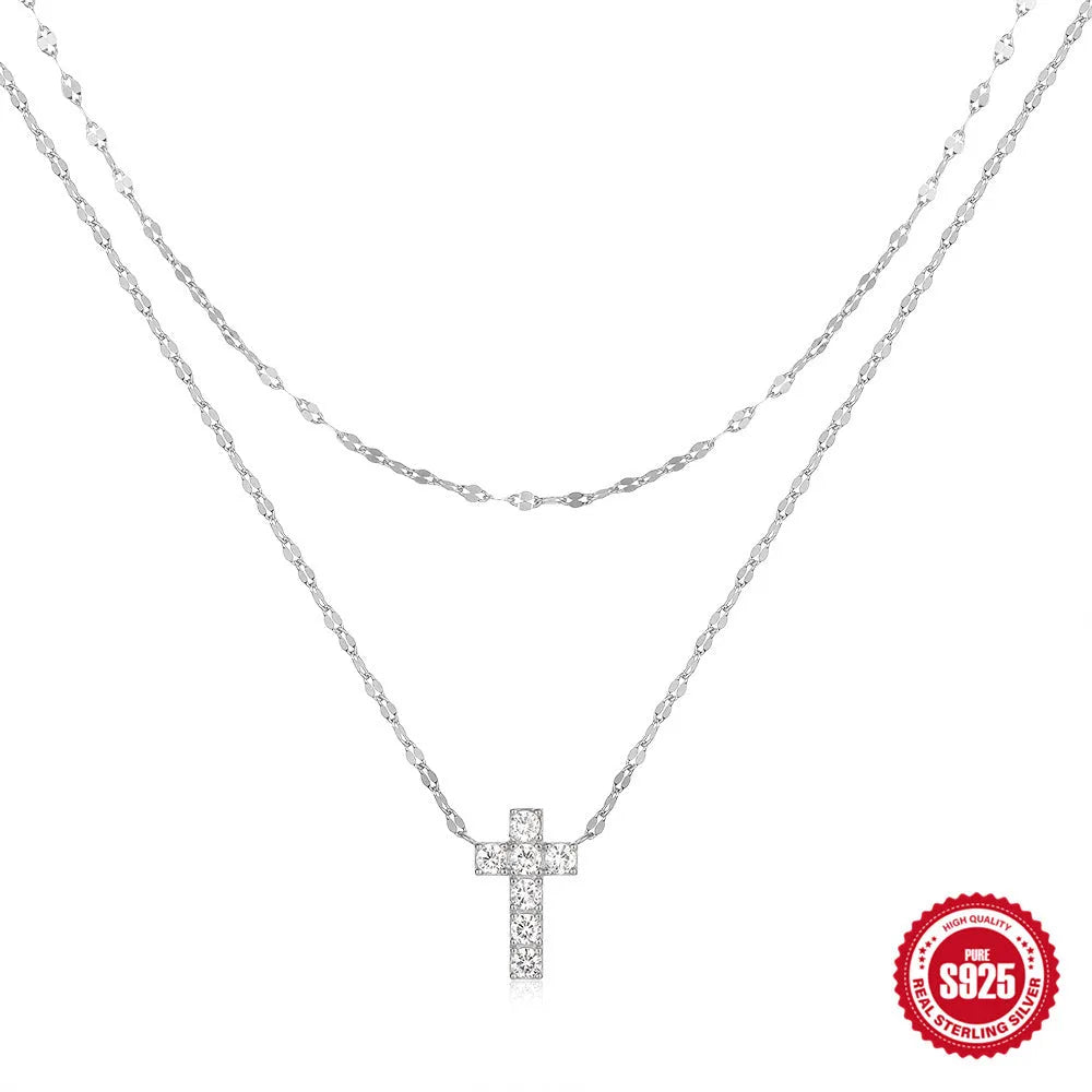 S925 sterling silver double layer geometric cross pendant necklace with twin diamond detail on a clavicle chain.