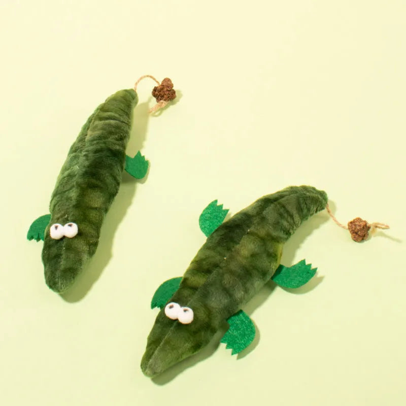 Green plush alligator cat toy with catnip and peppermint scent for oral cleansing and stress relief
