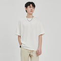 Men's loose fit drape knit T-shirt in polyester blend fabric available in black, brown, and white colours