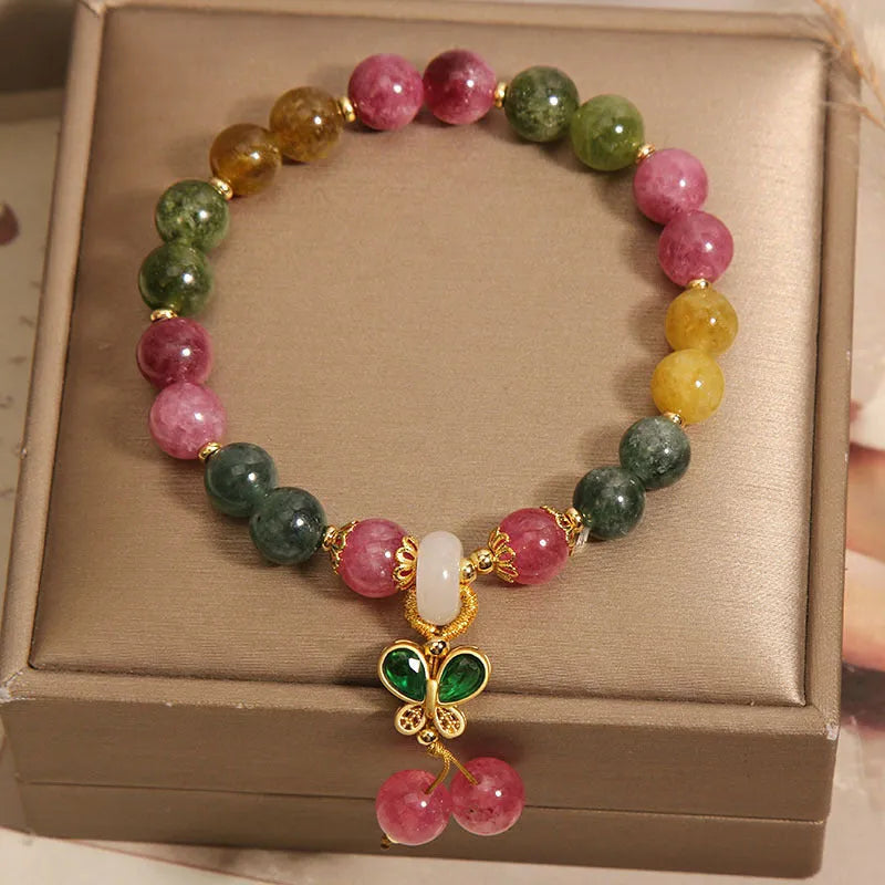 Tourmaline butterfly pendant bracelet with natural jade colour accents and rhinestone details on adjustable alloy chain
