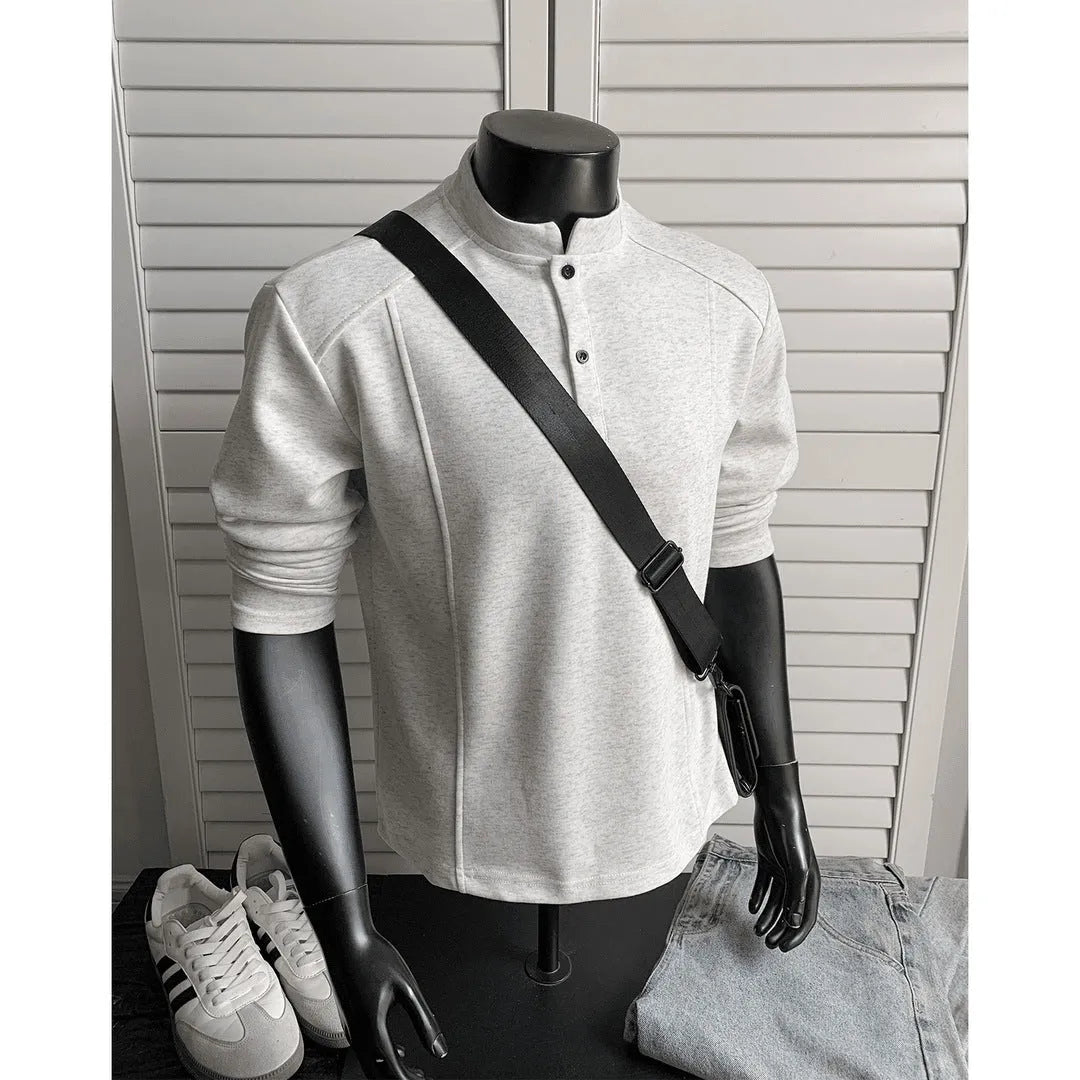 Men's loose-fitting asymmetric patchwork polo shirt with a stand-up collar and long sleeves in grey.