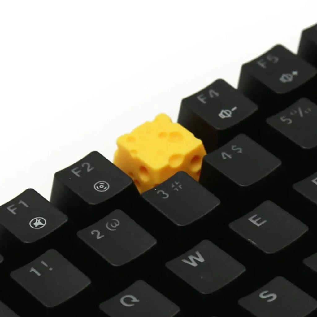 Yellow resin cheese design keycap for mechanical keyboards with Cherry MX switches.