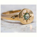 Gold coloured adjustable star ring with oval asterism zirconia stone.
