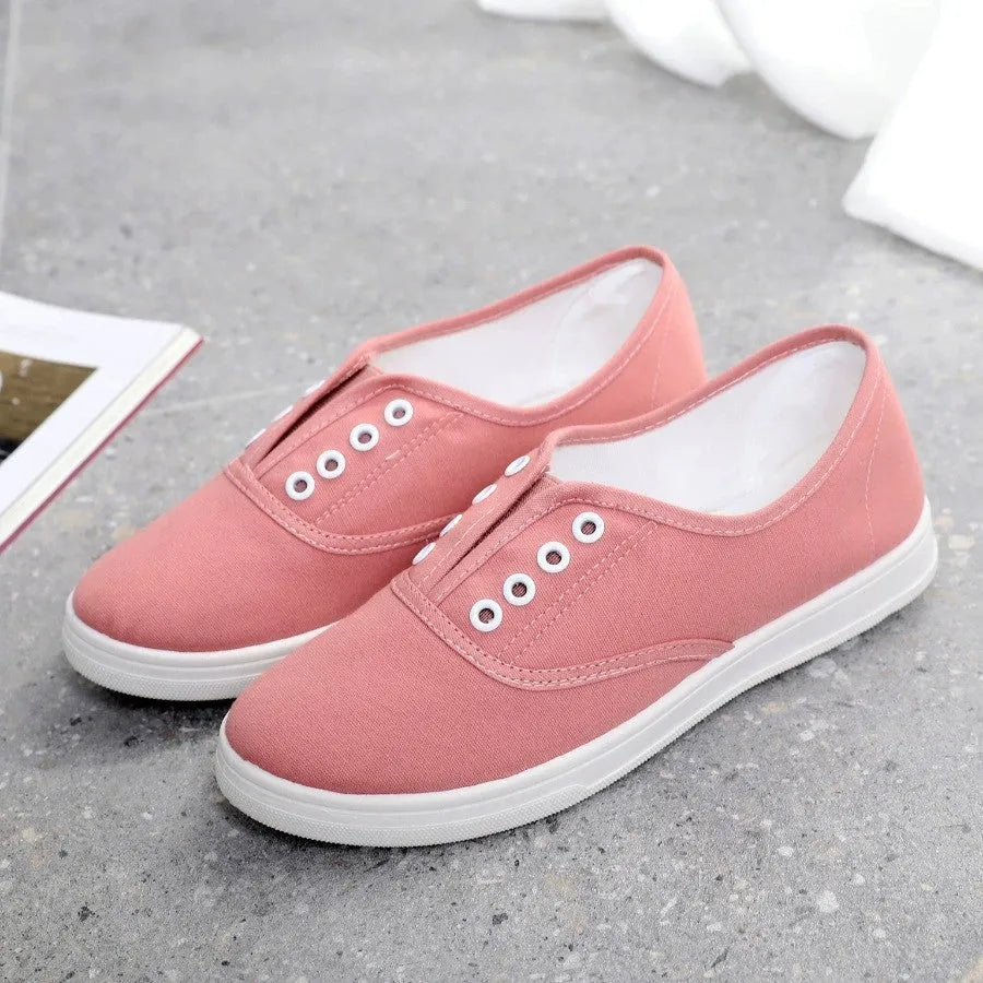 A pair of low-top canvas casual shoes in a choice of colours, featuring a flat heel and cloth lining.