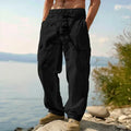 Men's loose-fit wide-leg cotton casual trousers in a solid colour with an elasticated waistband.