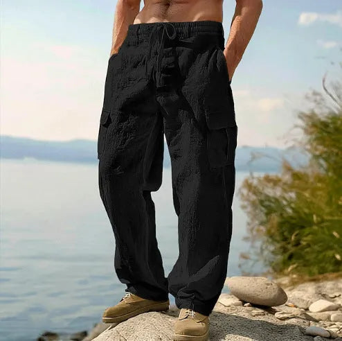 Men's loose-fit wide-leg cotton casual trousers in a solid colour with an elasticated waistband.