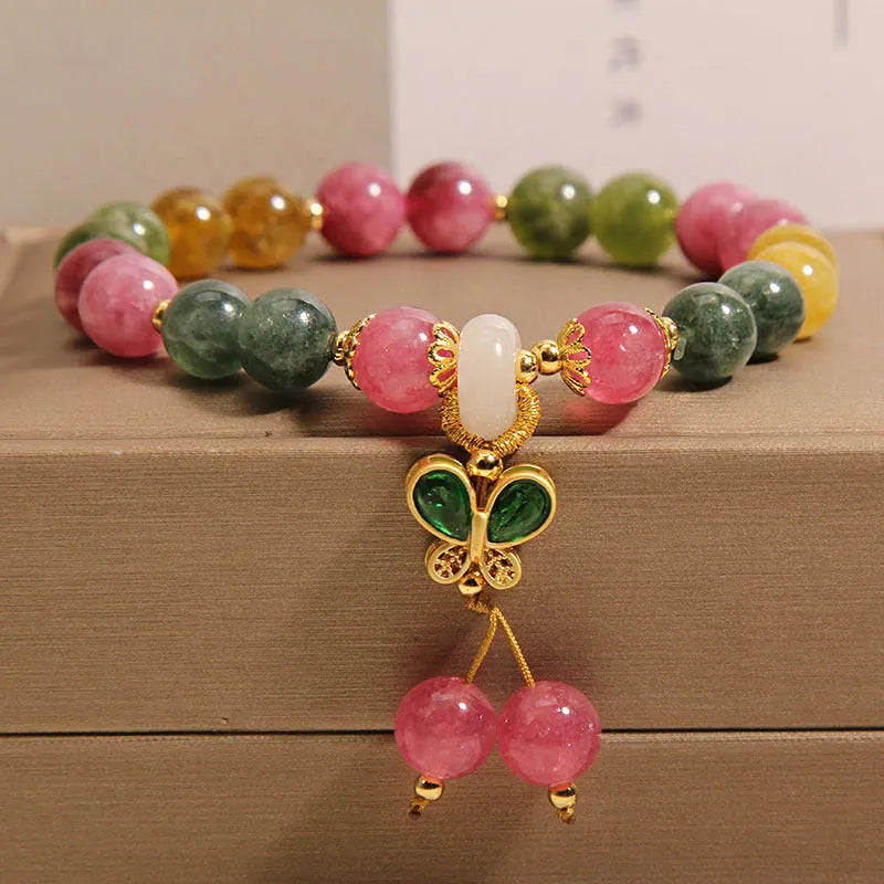 Tourmaline butterfly pendant bracelet with natural jade colour accents and rhinestone details on adjustable alloy chain