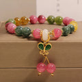 Tourmaline butterfly pendant bracelet with natural jade colour accents and rhinestone details on adjustable alloy chain