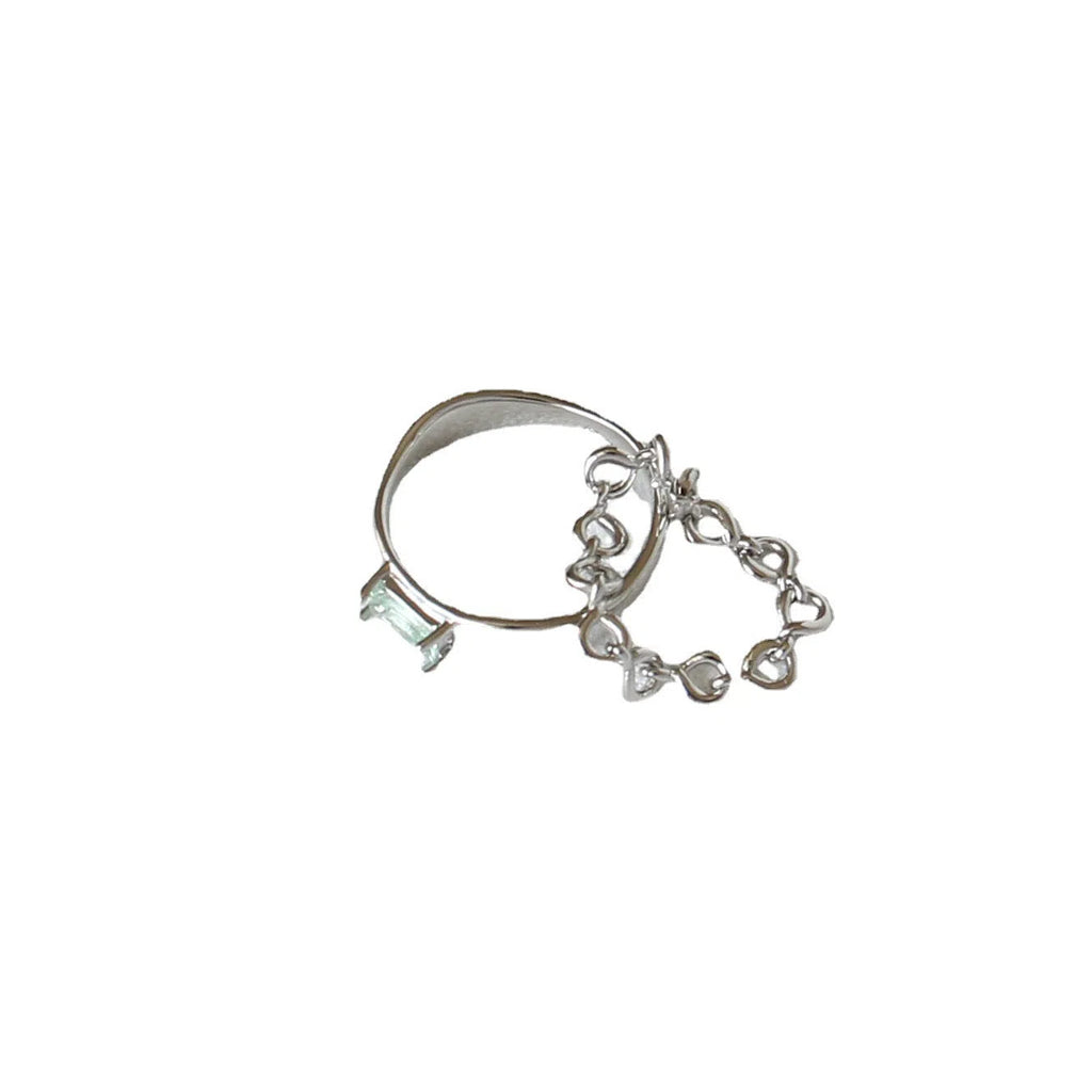 Copper platinum plated couple ring with three-ring gem design in style A on a neutral background