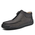 Men's black slip-on leather loafers with a round toe and low flat heel on a rubber sole.