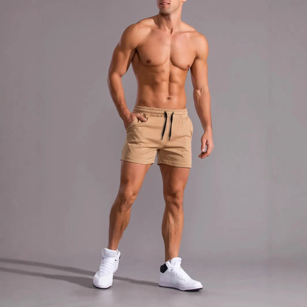 Men's solid colour drawstring shorts in black, khaki, and light brown from a 3-pack, loose fit.