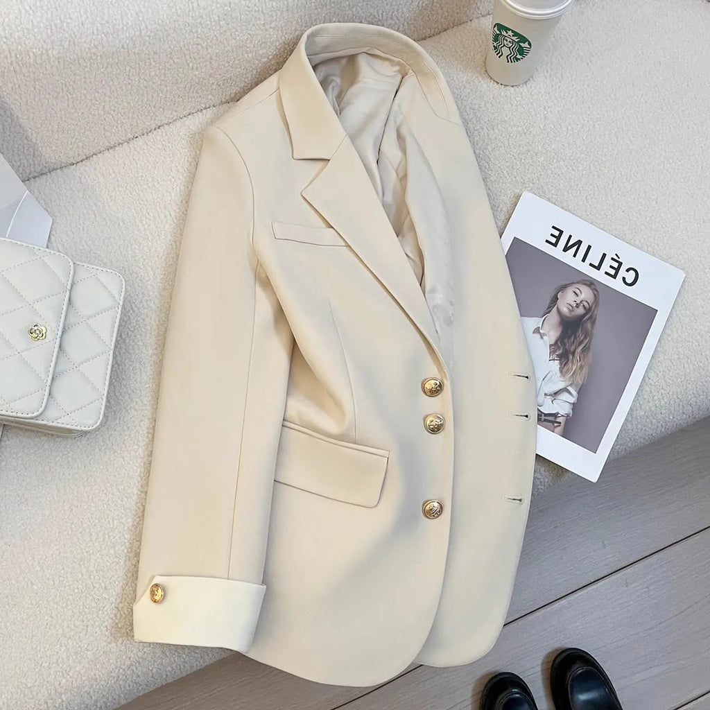Korean style loose fit women's coat in milky white, shown with long sleeves and pockets.
