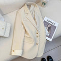 Korean style loose fit women's coat in milky white, shown with long sleeves and pockets.