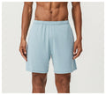 Men's double-layer running shorts in sky green colour on a mannequin, showing mid-waist and shorts length.