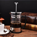 Compact glass pour-over coffee maker with stainless steel filter, 350ml capacity, 10cm wide.