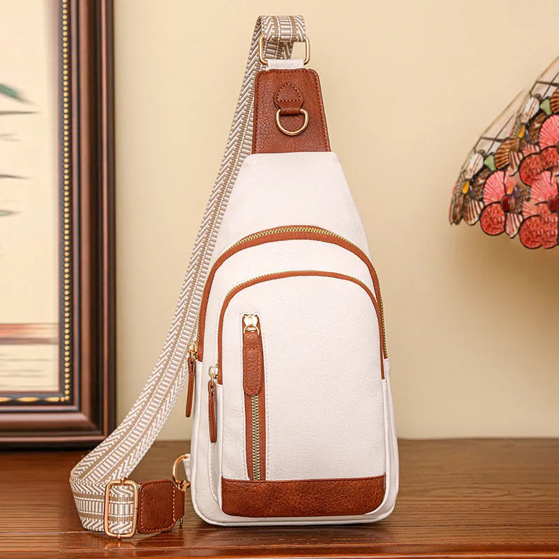 Soft brown PU leather women's crossbody chest bag with open pocket and stitching detail.