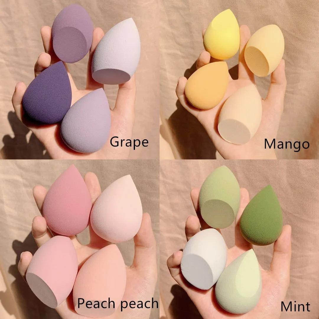 Box containing four coloured makeup sponge eggs in grape, mango, mint, and peach, each roughly 6cm in size.
