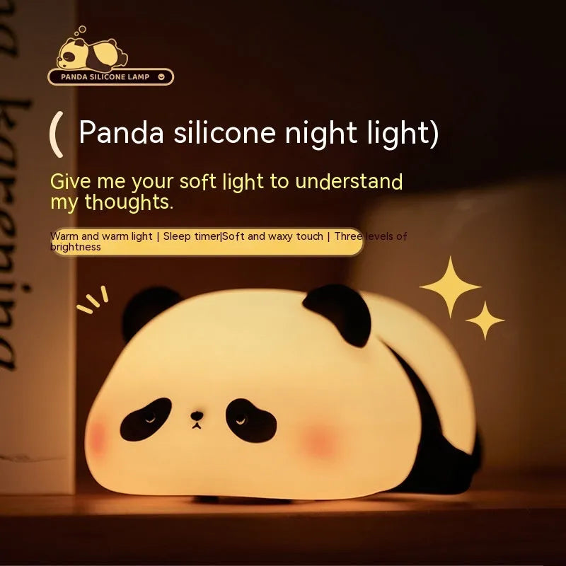 Cartoon panda-shaped silicone night light for children on a table.