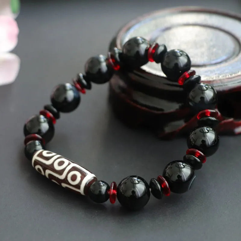 Black agate dzi bead bracelet with 11mm round beads in hand-woven geometry pattern