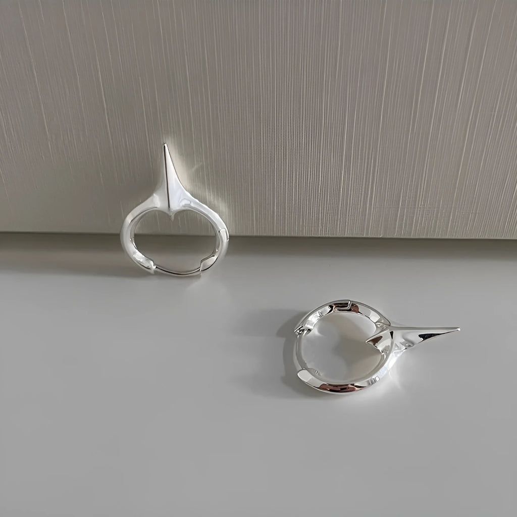 Geometric star-shaped ear clips for women with white gold plating in platinum colour