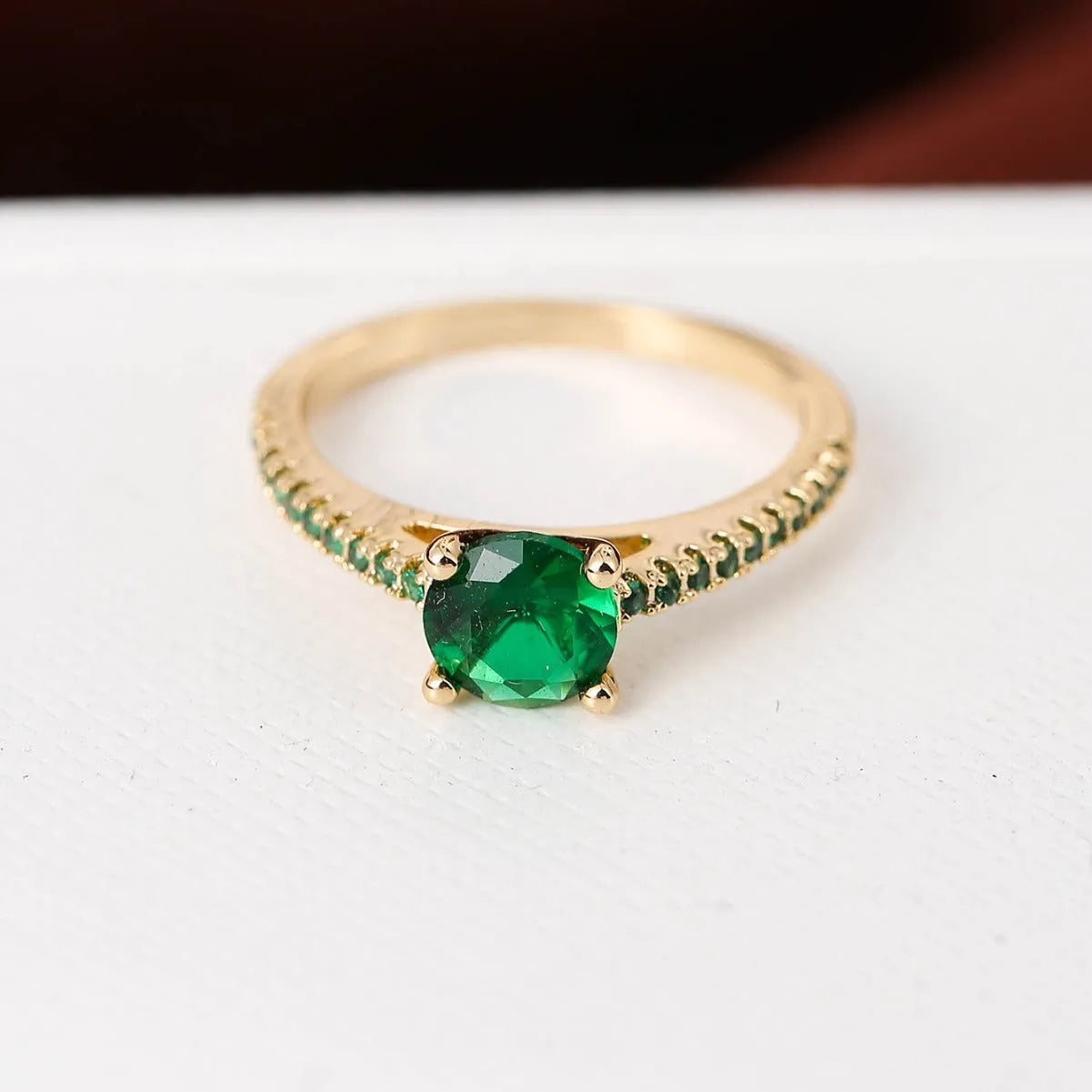 Copper zircon hexagonal geometric ring in a gold rose red electroplated finish.