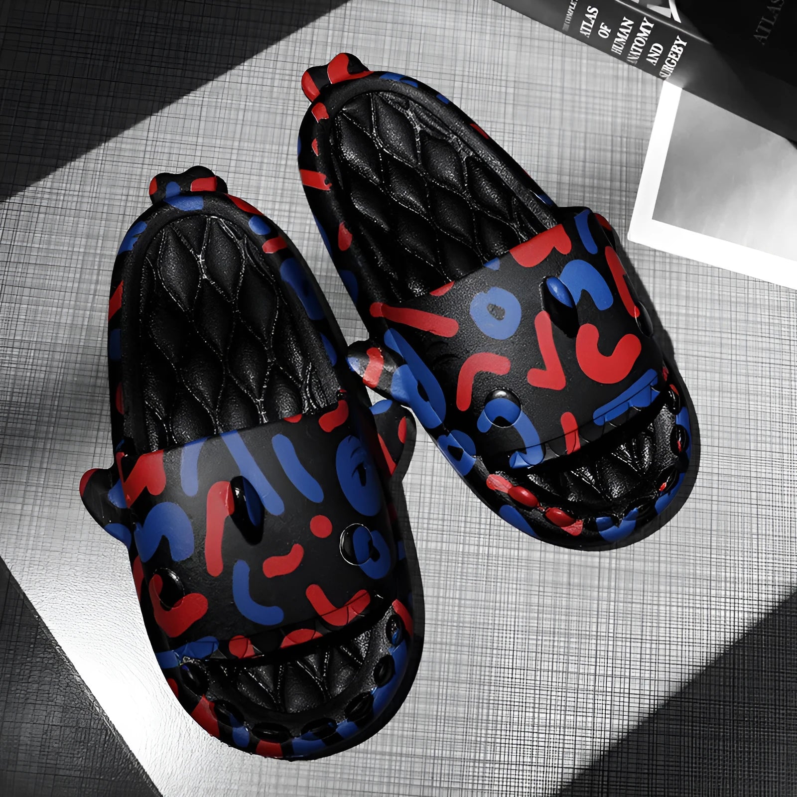 Casual open-toe EVA home slippers with a cute shark design on the upper.