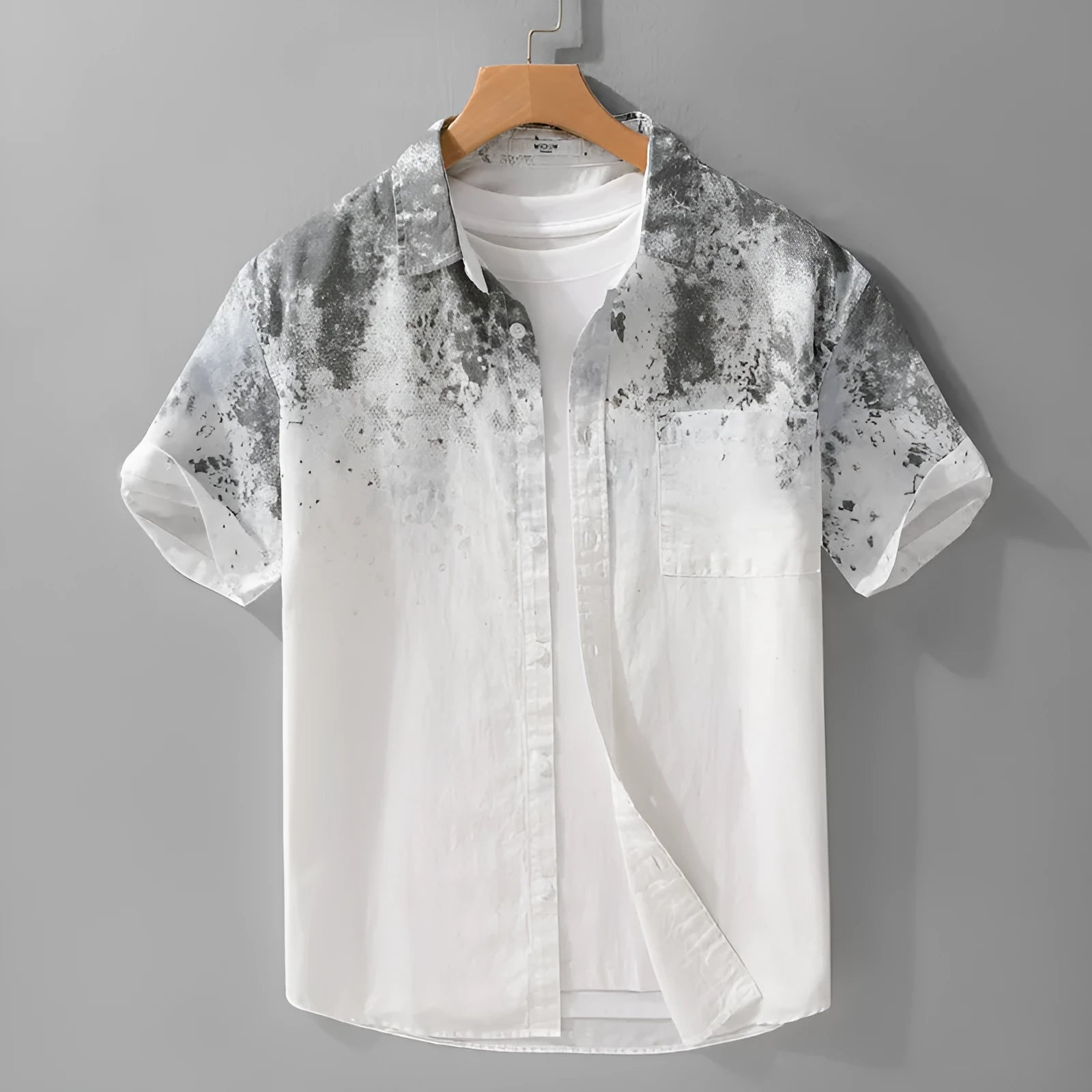 Men's loose-fit grey short-sleeved cotton shirt on a hanger