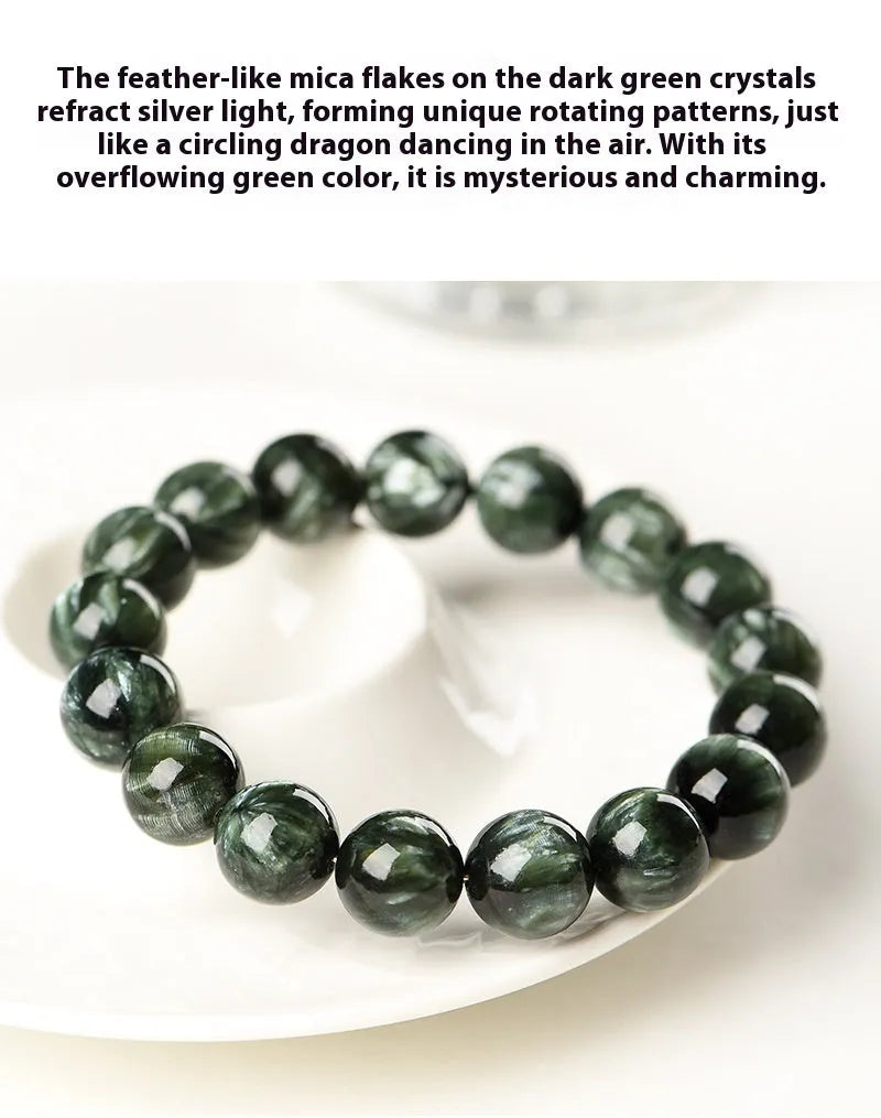 Natural green dragon crystal round bead bracelet with ruyi detail on a white background.