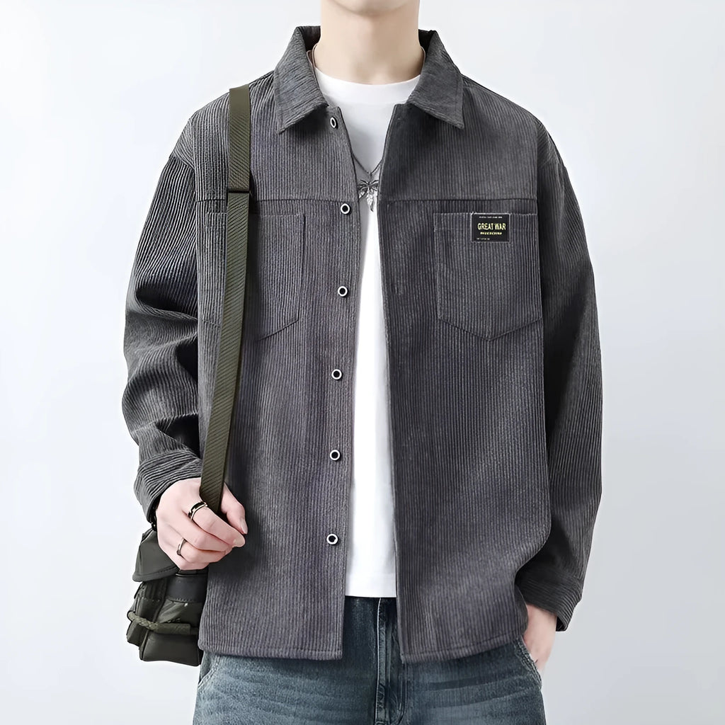 Men's black corduroy cardigan jacket with long sleeves on a hanger.