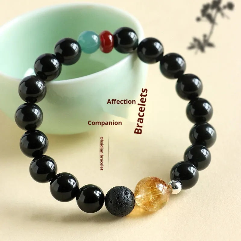 Chinese style obsidian and agate couple bracelet with yellow tower crystal and jade beads.