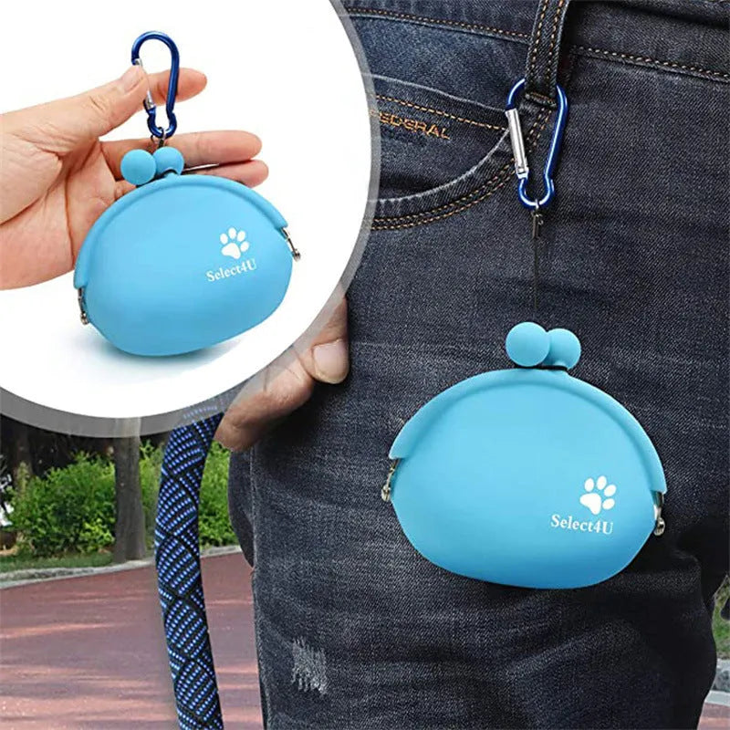 Yellow silicone dog training treat pouch with hook and loop closure, shown on a waist belt
