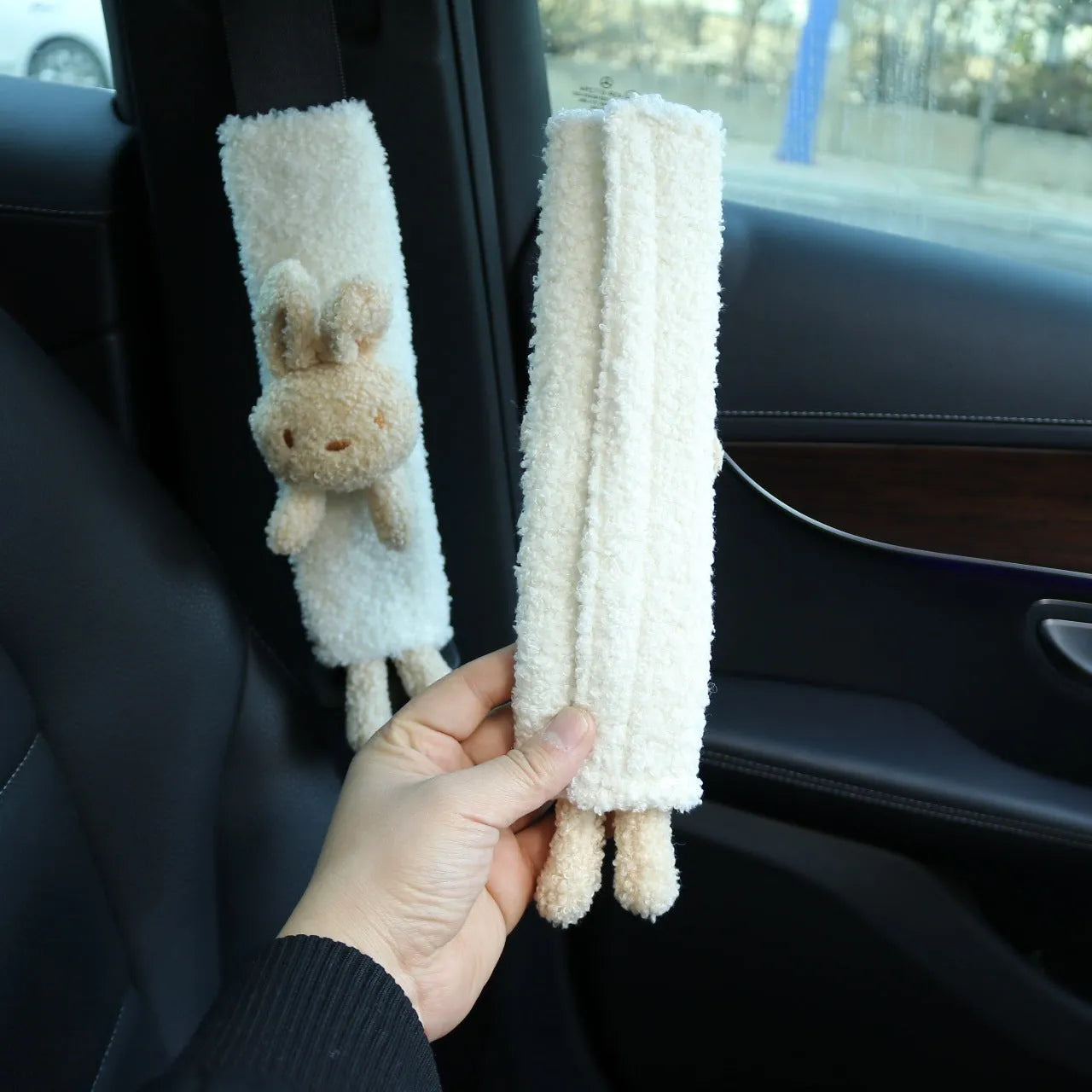 Cartoon plush car seat belt shoulder protector in lamb wool, showing rabbit and bear designs.