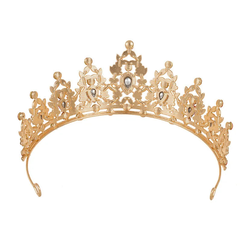 A silver and rhinestone baroque bride crown headdress with intricate detailing on a white background.