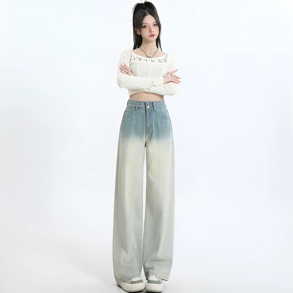 Gradient blue women's straight-leg denim trousers on a hanger, showing colour transition.